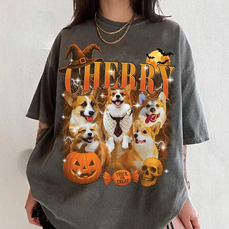 Person wearing a Halloween-themed t-shirt with corgi dogs and festive graphics.