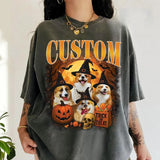 Person wearing a Halloween-themed t-shirt with dogs and pumpkins.