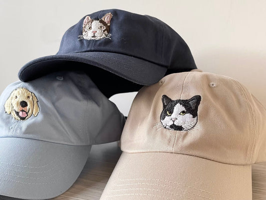 Custom embroidered pet hat featuring a pet’s name or face stitched on a cotton cap — perfect for dog or cat lovers